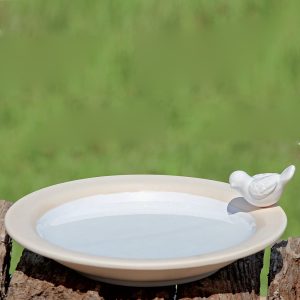 Fågelbad i vit keramik med dekor av fågel, diameter 20 cm.