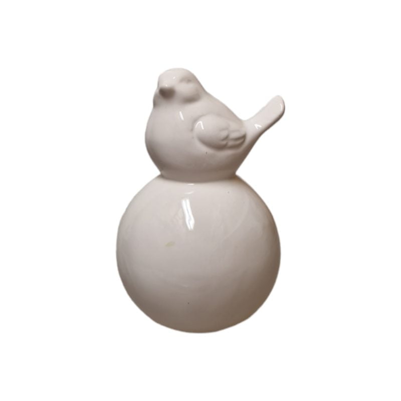 Liten fågel som sitter på ett klot. Material keramik. Höjd 12 cm.