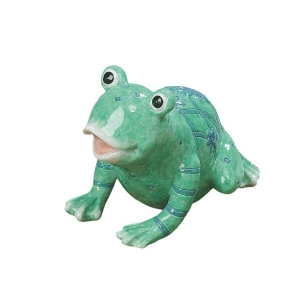 Dekorativ groda i keramik. Höjd 8,5 cm, längd 11 cm.